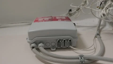 Low Angle View of Fiber Optic Network Distribution Box with Cables and Conduits Stock Footage 330090820
