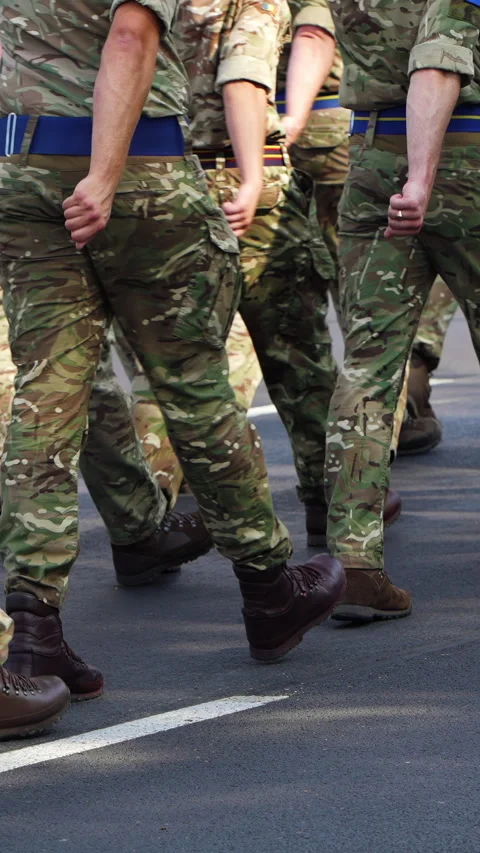 Low angle view field soldiers wearing camouflage marching together Video stock 289654030
