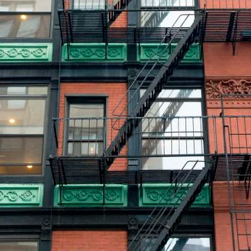 Low angle view of a fire escape on the exterior of a building in SoHo Manhattan Stock Photos