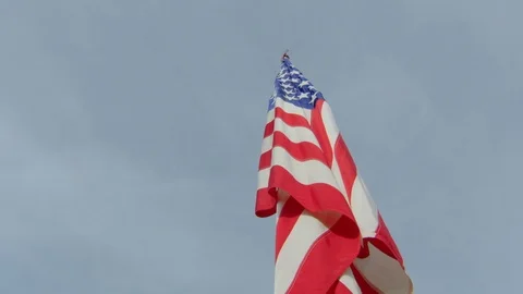 Low angle view of fireworks over American flag in stadium Stock Footage 104769520