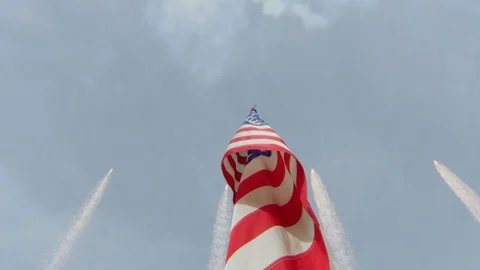 Low angle view of fireworks over American flag in stadium Stock Footage 104769546