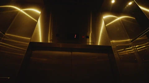 Low-angle view of floor display inside a dark elevator. Static medium shot Stock Footage 246502391