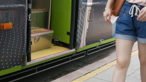 Low angle view to footpath at bus stop close up to bus door while passenger.. Stock Footage 267716456