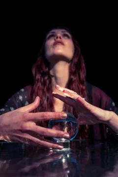 Low angle view of fortune teller using crystal ball Foto stock