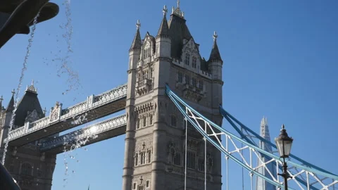 A low angle view of a fountain stream with the view of the Tower bridge. Stock Footage 144394735