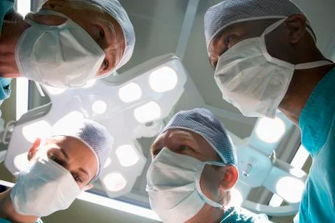 Low Angle View Of Four Surgeons Stock Photos