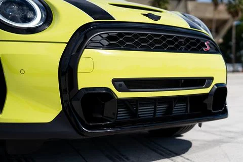 Low angle view of front bumper of yellow Mini Convertible S Cooper with black Stock Photos
