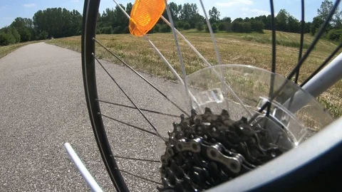 Low angle view of gear and wheeel of bicycle in movement Stock Footage 98150546