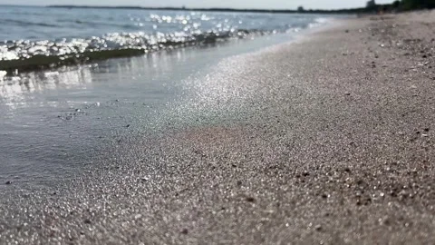 Low Angle View of Gentle Sea Waves Washing Sandy Sandy Beach in Bright Summer Su Stock Footage 340517000
