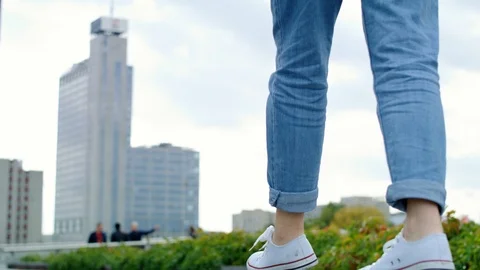 Low angle view of girl balancing in the city Stock-Footage 125603812