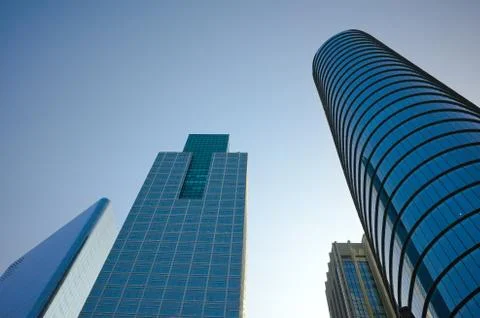 Low angle view of glass and steel building facade of modern office buildings. Stock Photos