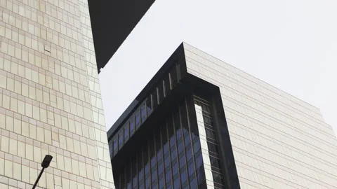 Low angle view of glass skyscraper rooftops. Stock Footage 306656252