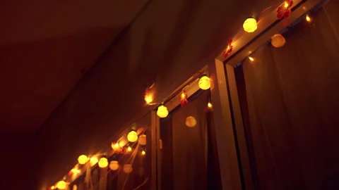 Low Angle View of Glowing Halloween Lanterns Along Window With Cobweb Decoration Stock Footage 337104682