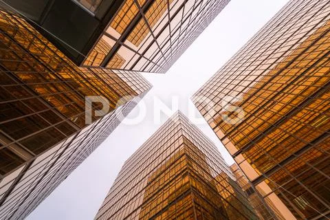 Low angle view of gold modern skyscraper business buildings Stock Photos
