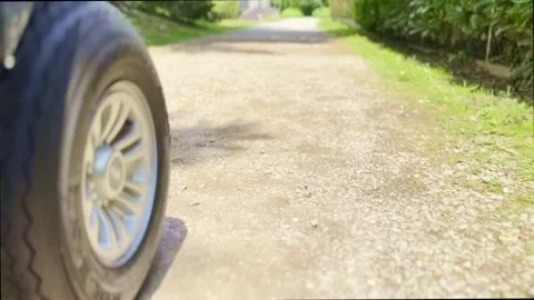 Low Angle View on a Golf Cart Travel on the Road on Golf Course Video stock 245265381