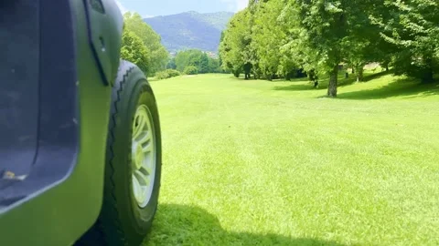 Low Angle View on a Golf Cart Travel on the Fairway on Golf Course Stock Footage 245266806