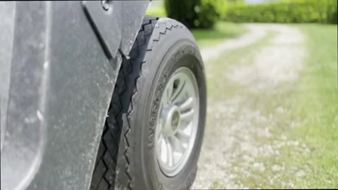 Low Angle View on a Golf Cart Travel on the Road on Golf Course Stock Footage 245266813