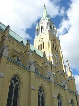 Low angle view of a Gothic revival cathedral bell tower in Lodz Poland 库存照片