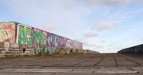 Low angle view of graffiti wall on abandoned concrete rooftop in Tallinn Stock Footage 321049177