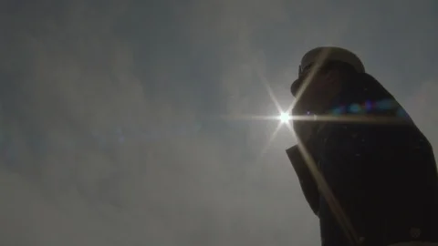 Low angle view of guard saluting flag and fireworks in background Stock Footage 104771082