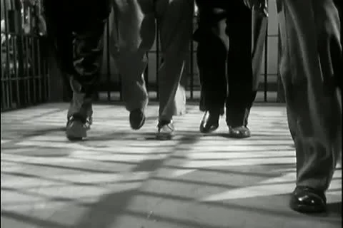 Low angle view guards bringing prisoner to his cell Stock-Footage 11346873