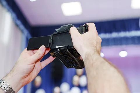 Low Angle View of Hands Raising Camera with Flip Screen Photos