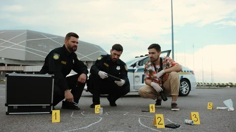 Low angle view of handsome men at work. Two policemen and CSI investigator Stock Footage 112982873