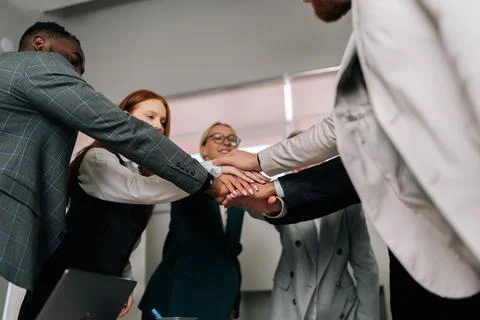 Low-angle view of happy team of business people make building successful Stock Photos