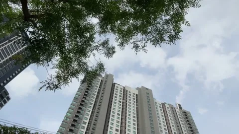 Low angle view high condominium timelapse blue sky with cloud trees. Thailand Stock Footage 225932463
