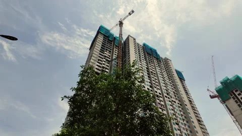 Low-angle view of a high-rise residential building under construction Stock Footage 280243413