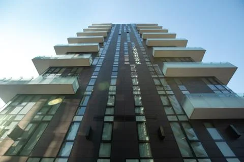Low angle view of a high rise building with lots of protruding balconies Stock Photos