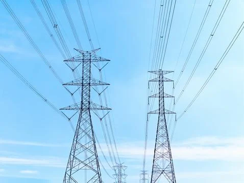 Low Angle View of High Voltage Electrical Transmission Towers and Cables Stock Photos