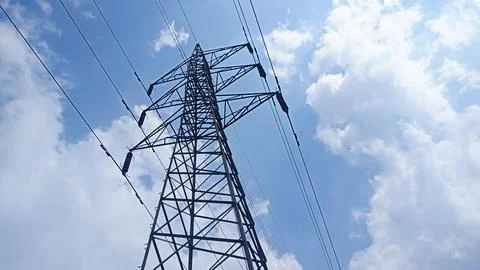 Low angle view of a high voltage power transmission tower Stock Photos