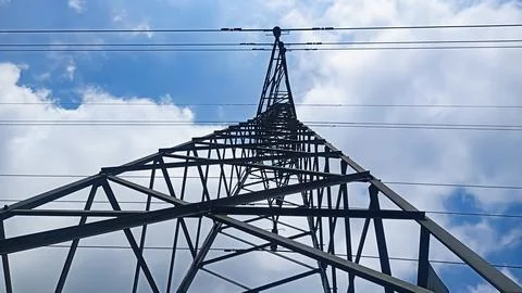 Low angle view of a high voltage power transmission tower Stock Photos