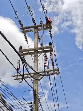 Low angle view of high voltage twisted aerial bundled cable termination. Stock Photos