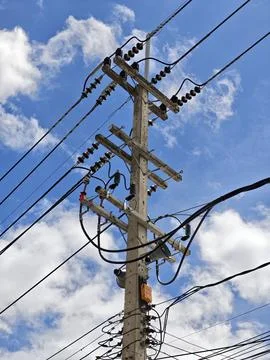 Low angle view of high voltage twisted aerial bundled cable termination. Stock Photos