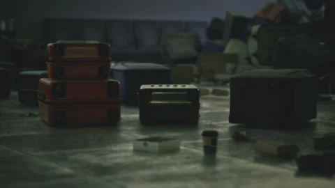 Low angle view highlighting floor clutter with blurred luggage Stock-Footage 334043042