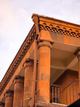 Low-angle view highlights classical columns and ornate roofline details Stock Photos