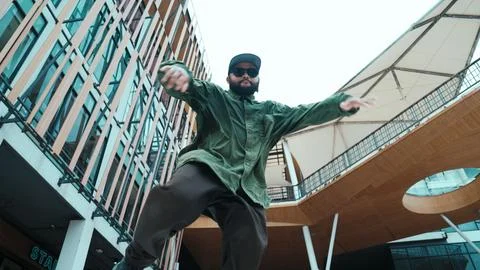 Low angle view of hipster pose in hip hop style surrounded by mall. Endeavor. 写真素材