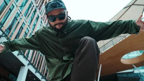 Low angle view of hipster pose in hip hop style surrounded by mall. Endeavor. 写真素材