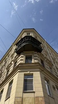 Low angle view of a historic beige building corner featuring classical Stock Photos
