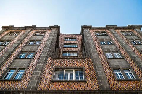 Low angle view of historic building facade with colorful geometric Talavera tile Stock Photos