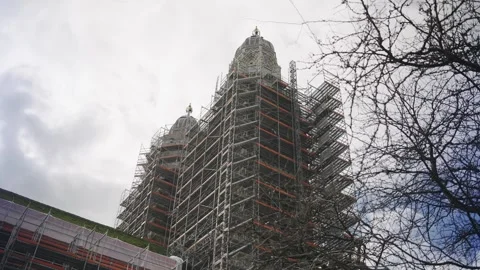 Low angle view of a historic church tower covered in extensive scaffolding Stock-Footage 331565162