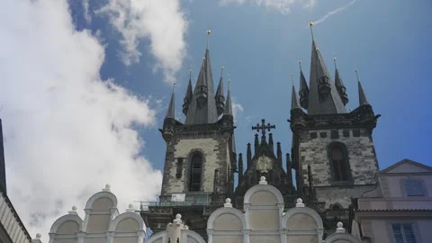 Low angle view of the historic gothic church towers against a blue sky Vídeos de archivo 334180274