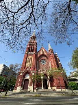 Low-angle view of a historic red brick church Foto stock