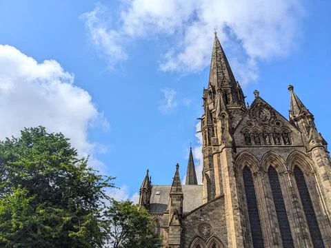 Low angle view of the historic St. Marys Cathedrals Gothic facade and spires in Stock Photos