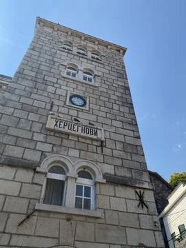 Low-angle view of the historic stone Clock Tower in Herceg Novi, Montenegro Stock Photos