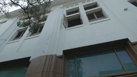 Low angle view of a historic white colonial building facade with windows Video stock 343417312