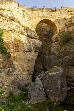 Low angle view of the historical Puento Nuevo (new bridge) that runs over the Stock Photos