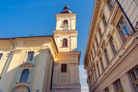 Low angle view of Holy Trinity Roman Catholic Church tower between historic.. Stock Photos